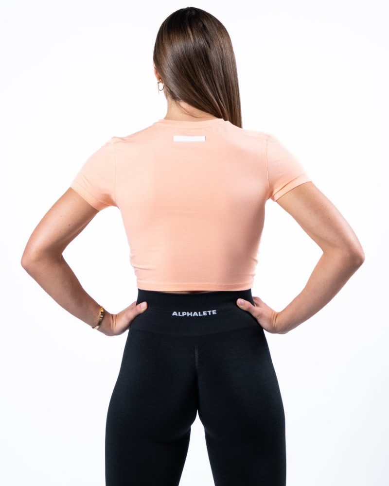 Women's Alphalete Evo Twist Crop Shirts Cheeky Coral | 0321-YXIUW